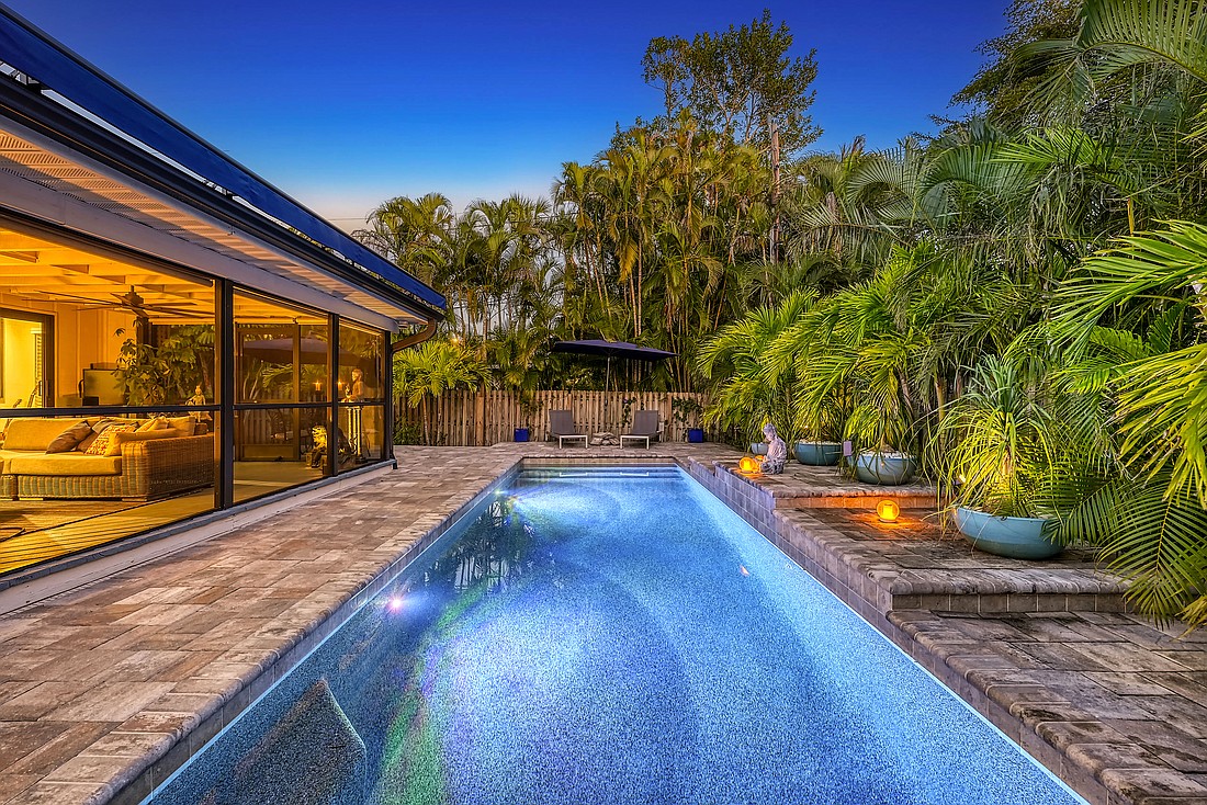 A home in Bay Island Park ties with a Sarasota Beach home in topping all transactions in this week's real estate. The home at 3455 Anglin Drive sold for $2.4 million.