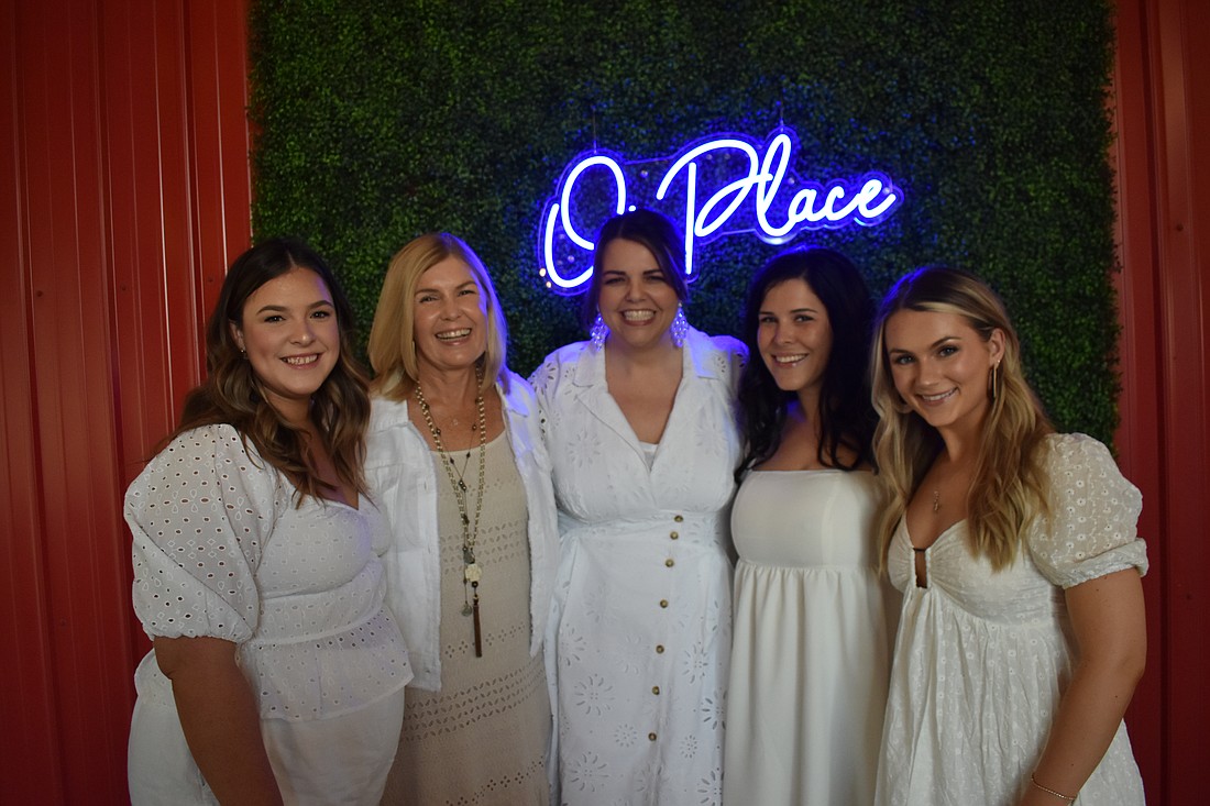 OnPlace staff members celebrating the company's one-year anniversary are 
Erin Steele, community relations, Sandy Friedman, business development, Monaca Onstad, president and CEO, Amanda Arnold, vice president, and Mackenzie Straley, director of community experience.