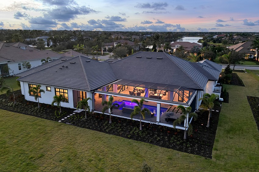 The new owners can relax around the pool in the evening.