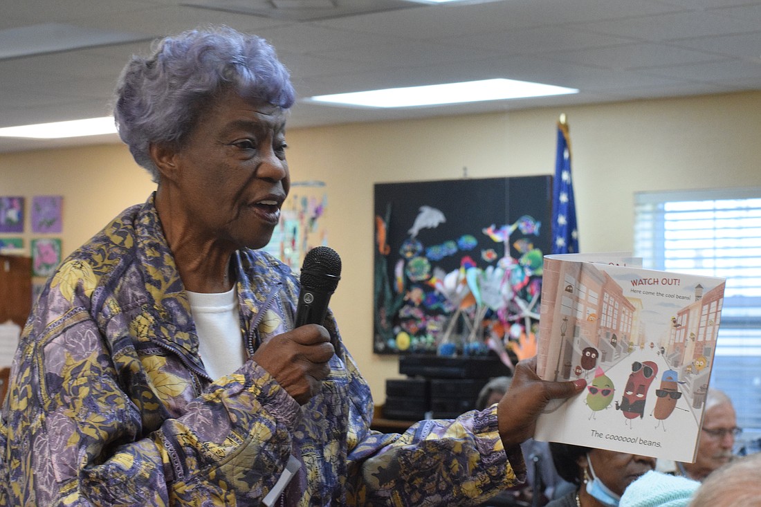Gwendolyn Smith, a client at Daybreak Adult Day Center, feels like a teacher again when she's reading to Braden River Elementary School first graders.