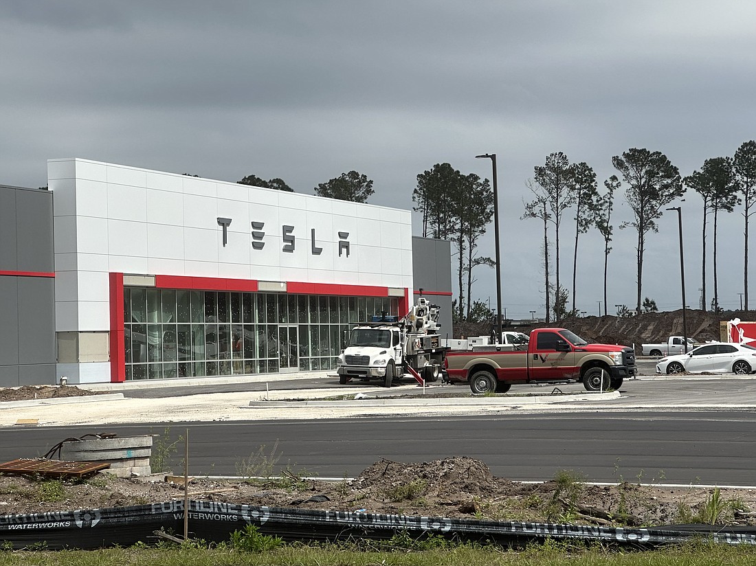 The Tesla sign is up at Atlantic and Abess boulevards in East Arlington.