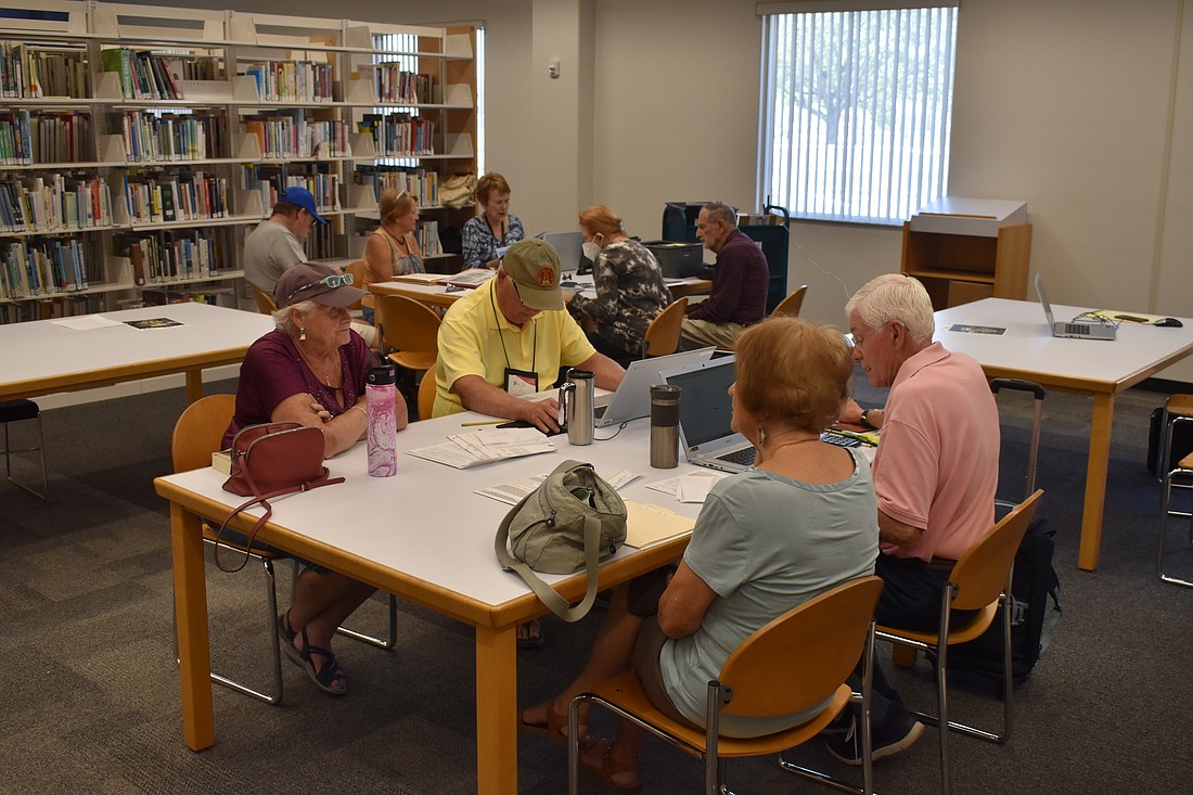 AARP volunteers provide assistance at Fruitville Public Library.