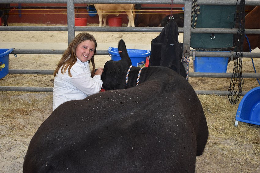 10-year-old Rebecca Souders and her cow Dunkin