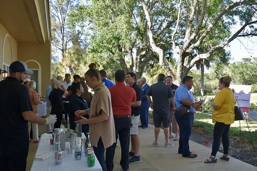 About 45 chamber members gathered behind the Tidewell Building on March 23 for Off the Clock.