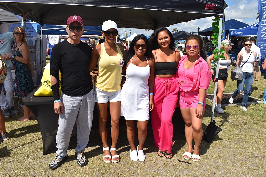 The Merly Mae's Filipino Catering stand included Kerwin Arnejo, business owner Merly Mae Soliano, Nora Stevens, Phoebe Perez, and Kristel Stroble.
