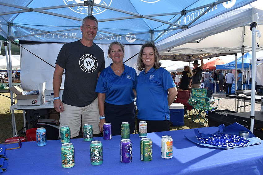 The Hancock Whitney stand was staffed by Sarasota's Tony Gabriel, Sarasota's Amy McKenna, and Lakewood Ranch's Cherri Kessler.