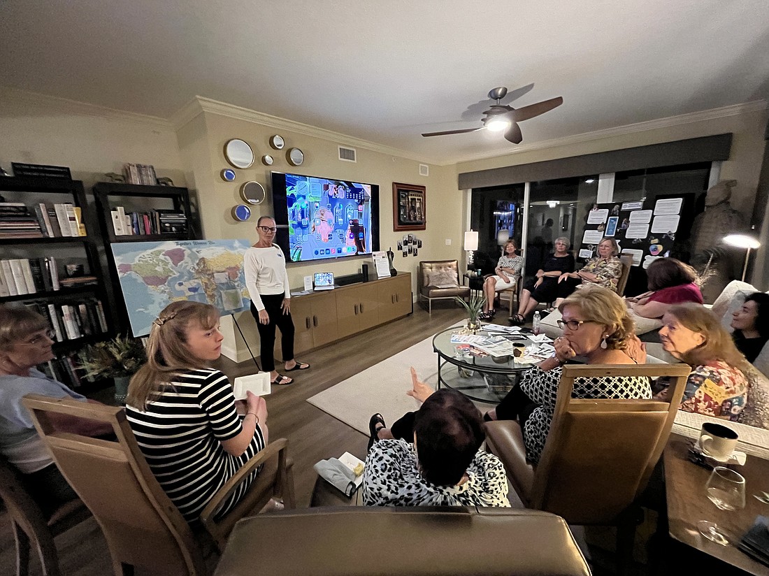 Women discuss Too Young to Wed, an organization dedicated to ending child marriage globally, during a Potlucks for a Purpose meeting.