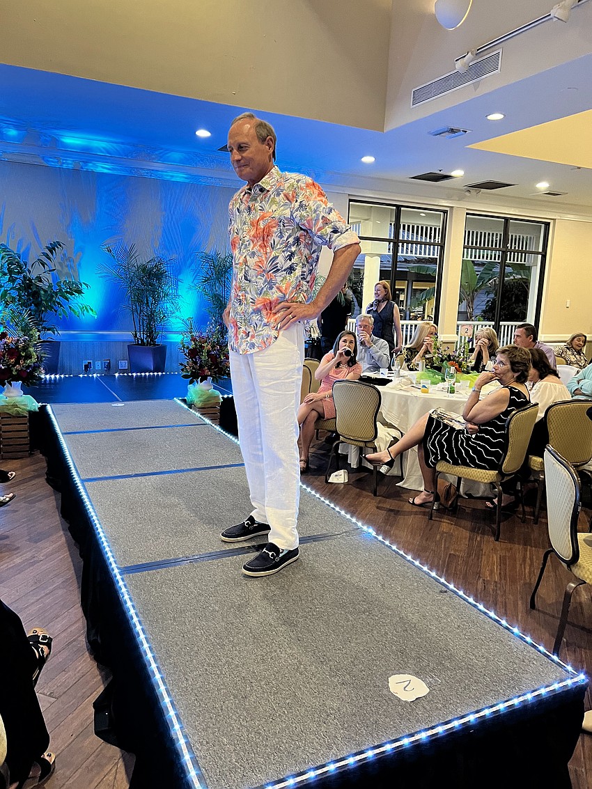 District 1 Commissioner Gary Coffin models a flowered buttondown with white pants.