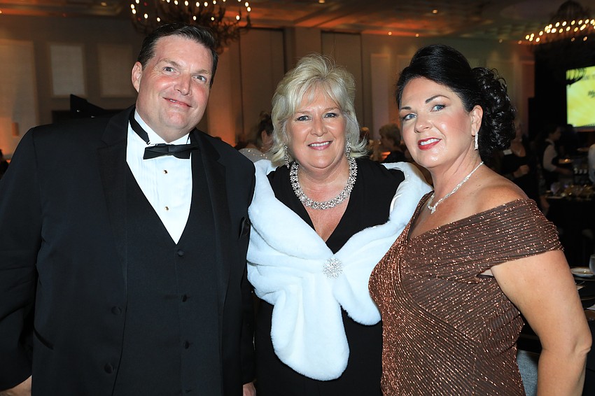Mario Palmer, president and CEO Maribeth Phillips and Carey Palmer. Phillips spent the cocktail hour welcoming an assortment of guests.