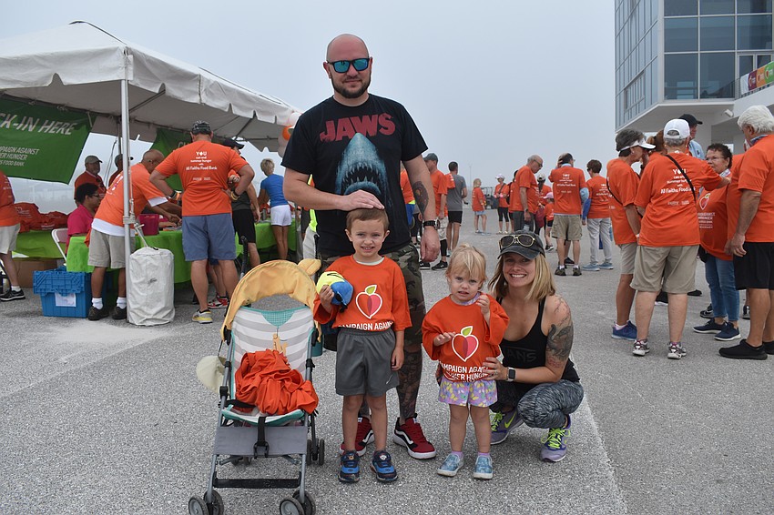 Charlie Moone, 4-year-old Logan Moone, 2-year-old Peyton Moone, and Nikki Moone prepare for the walk.
