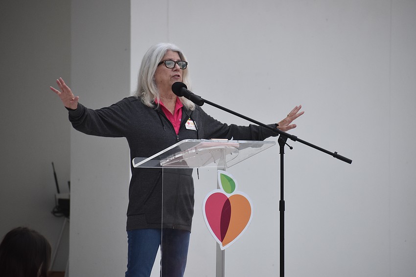 All Faiths Food Bank CEO Sandra Frank speaks before the walk.