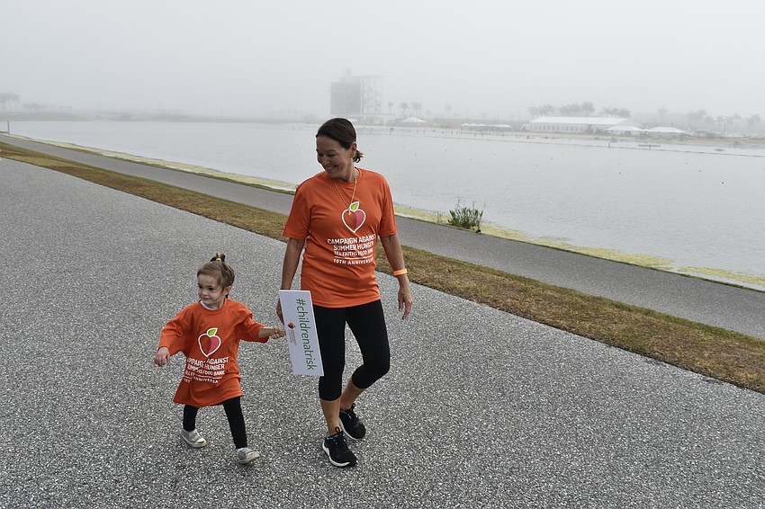 3-year-old Gracie Littlefield and Jenny Littlefield participate in the walk.