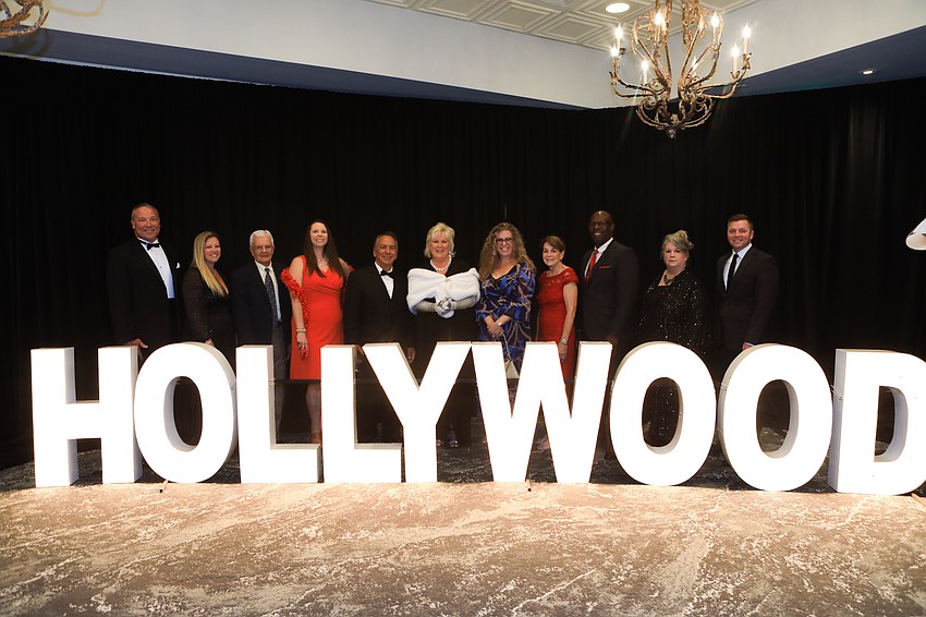 Meals on Wheels Plus of Manatee board members line up for a photo at the start of the program.