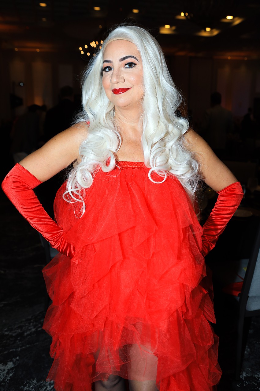 Sylvia Day stood out in the crowd with her bright red attire.