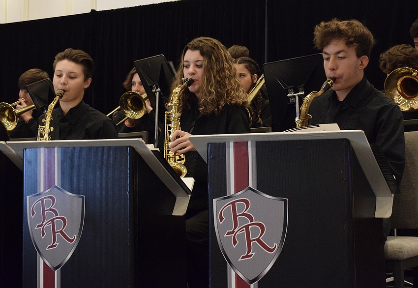 Braden River High School's Makayla Mocadlo, Ava Clouse and Sebastian Cullado have fun performing with the jazz band.