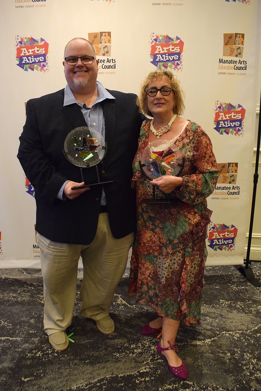 Bill Ferrell, a commercial art teacher at Braden River High School, and Roxane Caravan, the theater department director at Lakewood Ranch High School, are honored with awards at Arts Alive.