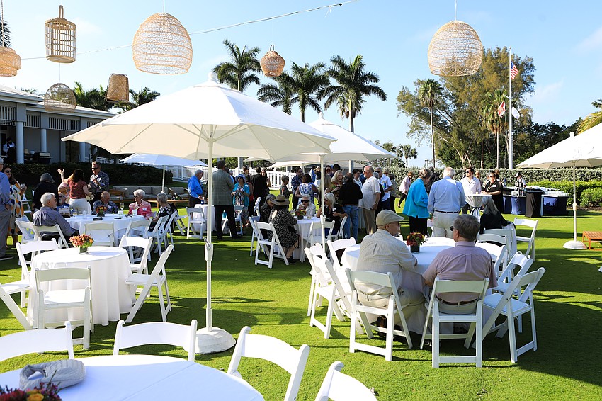Guests met in shaded areas during the social hour.