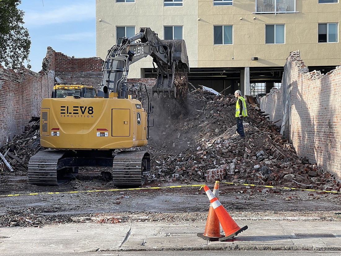 ELEV8 Demolition tears down the 109-year-old building at 618 W. Adams St. in LaVilla on March 29 owned by  Bravo TV personality Capt. Sandy Yawn.