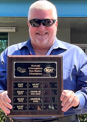 Sarasota County Transit Operations Manager Benjamin Pearl with the 2023 Rodeo plaque.