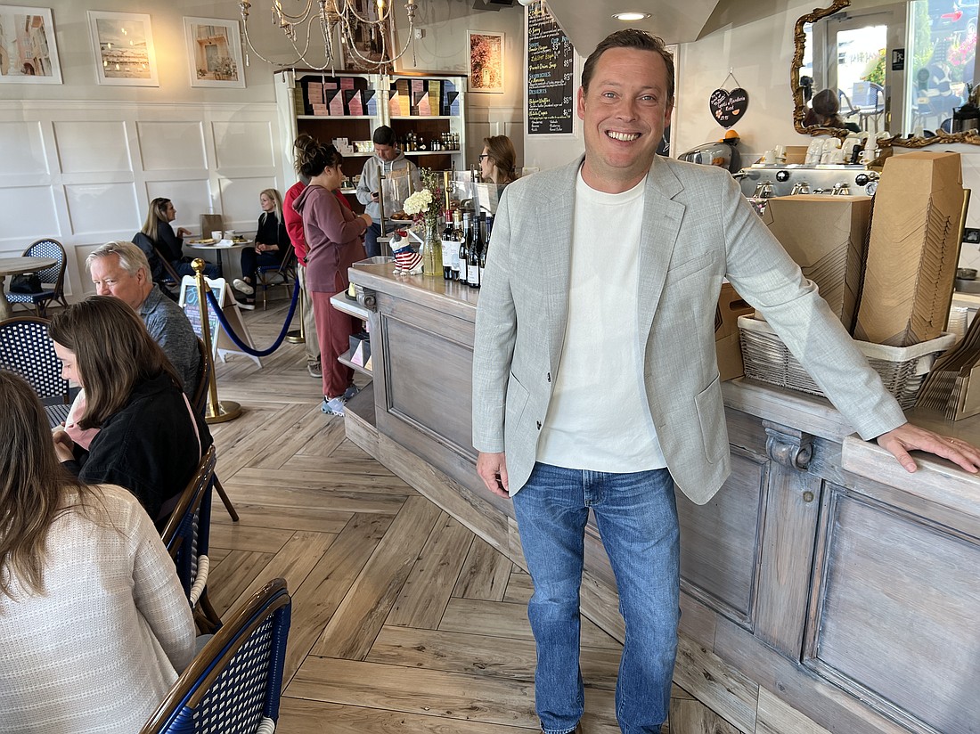 Owner Alex Chezaud oversees a busy morning at Le Petit Paris in Atlantic Beach. He came to the United States for a six-month stay and ended up making Florida his home.
