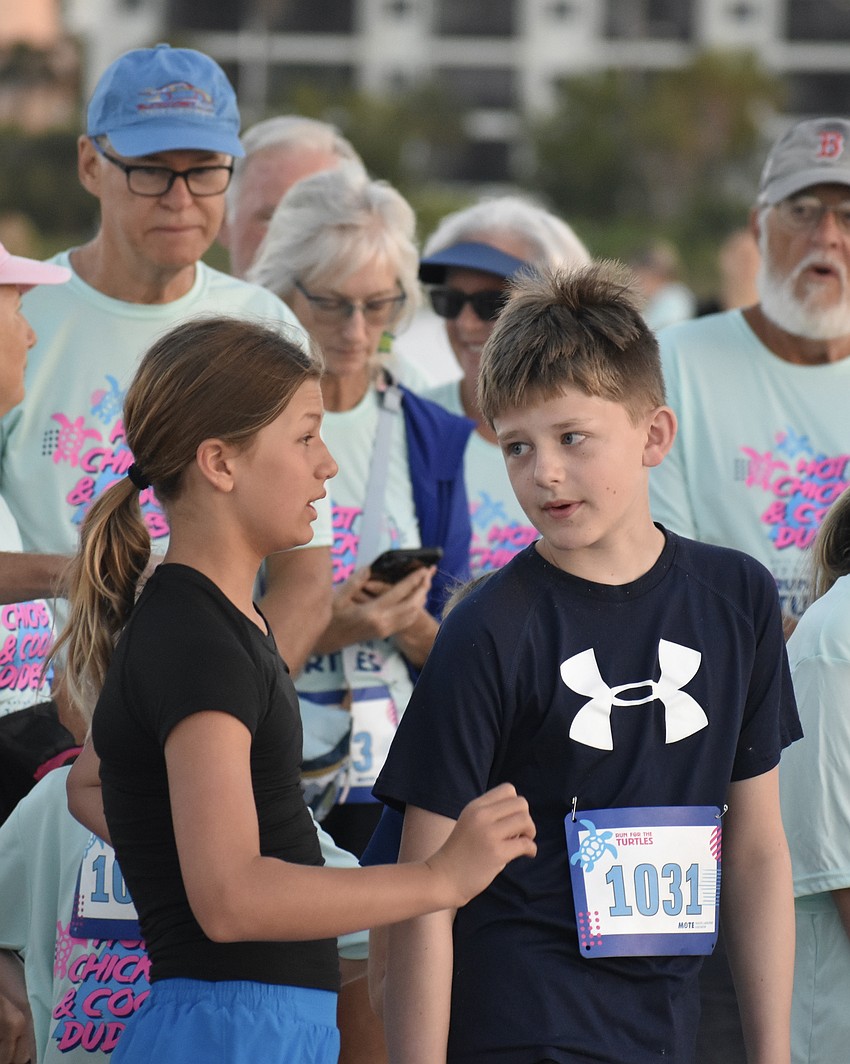 10-year-old Maddy O'Connell and her 11-year-old cousin Jack Laurich prepare for the 1-mile race.