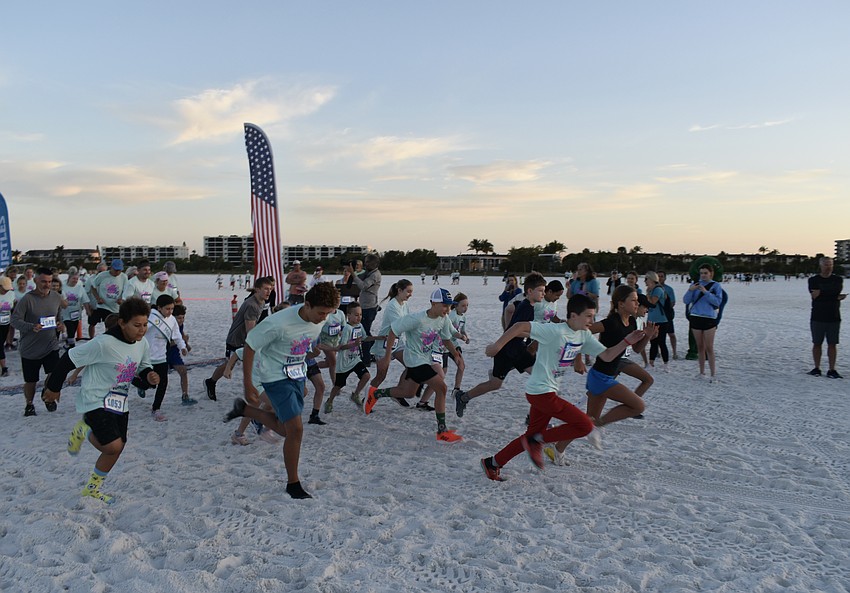 The 1-mile fun run begins.