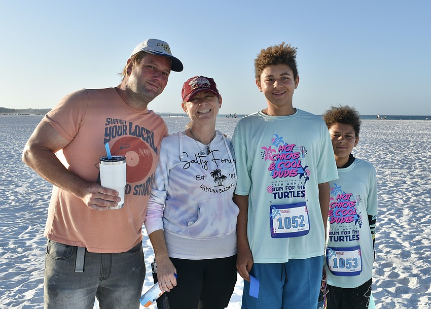 Andrew Granken, Michele Cobb, 2nd place winner in the 5K race, 13-year-old Shane Cobb, and 11-year-old Cameron Cobb