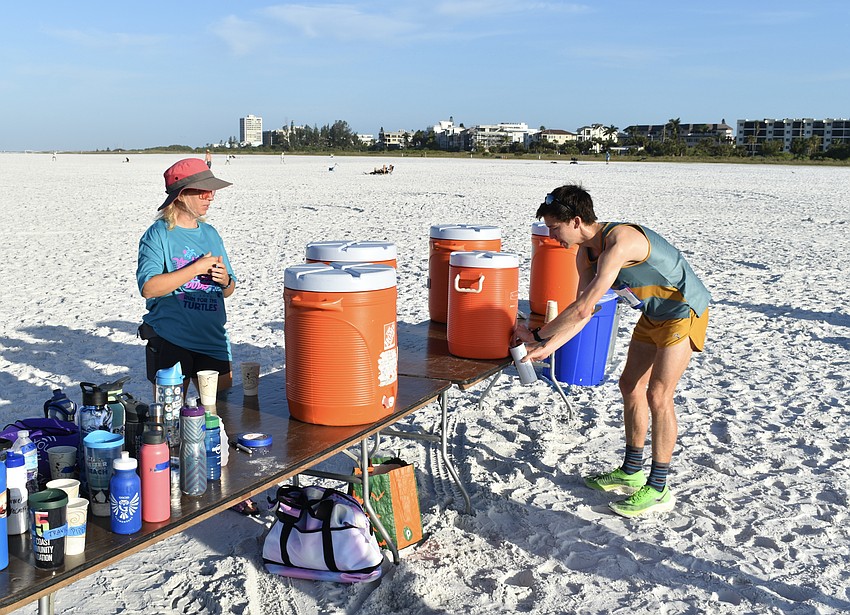Mote volunteer Jody Rioux assists Alex Milne.