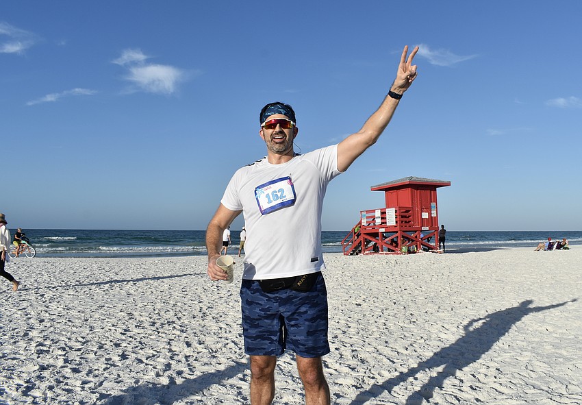 Dan Kiernan celebrates his completion of the 5K.