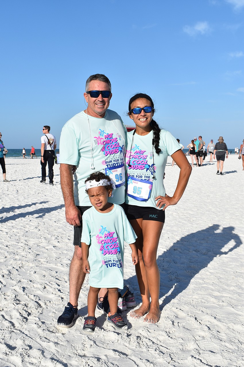Jared Duke, 3-year-old Desmond Duke, and Alexis Garcia.