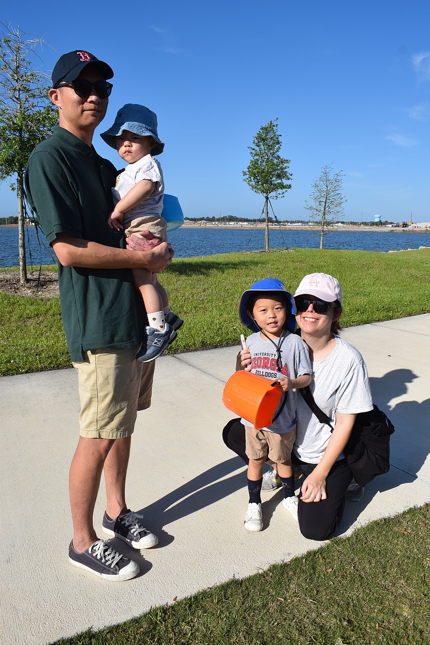 Lakewood Ranch's Polin Wang, 1-year-old PJ Wang, 3-year-old Enyu Wang and Meiyin Chen enjoy their first EGGstravaganza.
