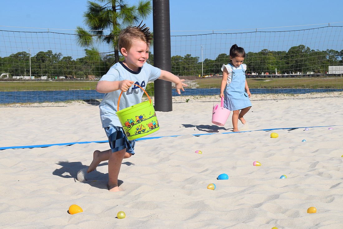 Myakka City's Riley Smith, who is 5, runs as fast as he can to collect eggs April 1, 2023, at EGGstravaganza.