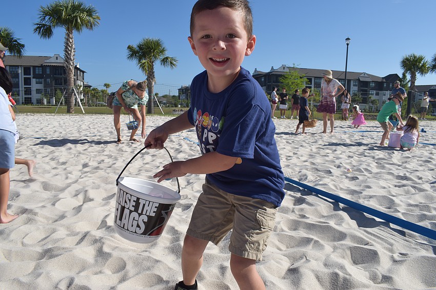 Lakewood Ranch's Brayden LaBonte, who is 5, is all smiles while collecting eggs.
