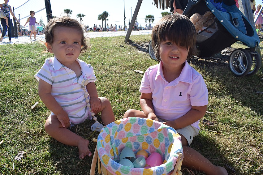 Lakewood Ranch 9-month-old Julian Zapata and his 2-year-old brother Luca Zapata look at the prizes in their eggs.