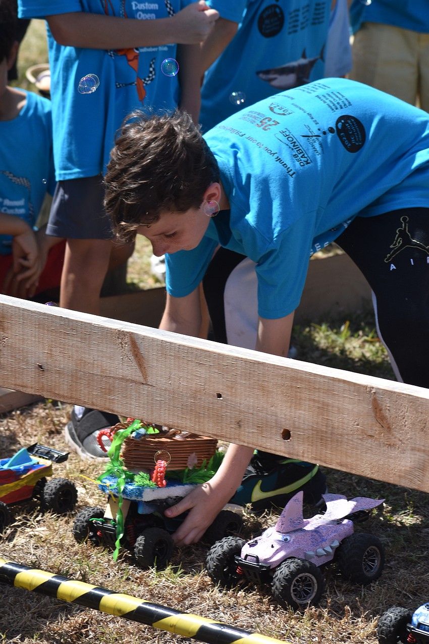 13-year-old Patrick Githens of the Sunny Sharks prepares to race on the obstacle course.