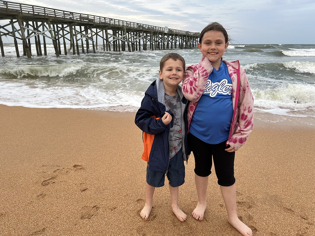 Luke and Kennedy were unfazed by the chilly weather at Flagler Beach. They were also unfazed by their father's stern warnings to not get their clothes wet. Photo by Brian McMillan