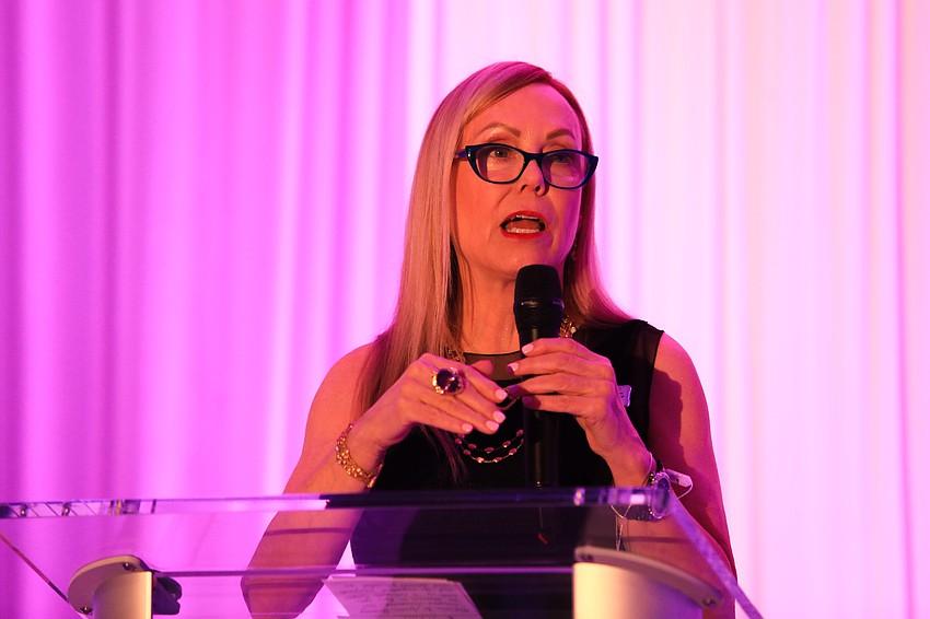 Event chair Vickie Smith opens the program.