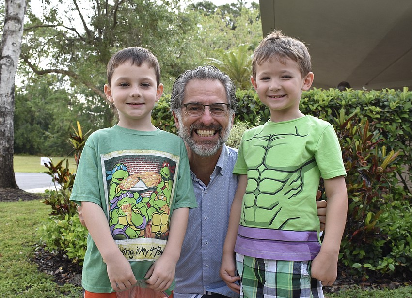 6-year-old Colton Zukas, Rabbi Brenner Glickman, and 4-year-old William Friedman