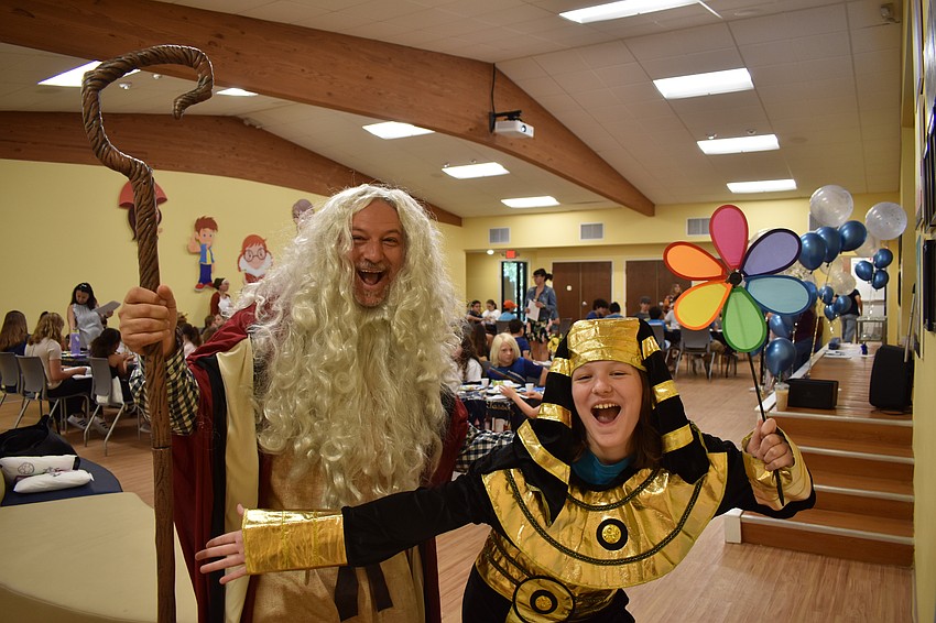 Rabbi Michael Shefrin and Libbie Lurie reenacted the Passover story, dressed as Moses and Pharoah.