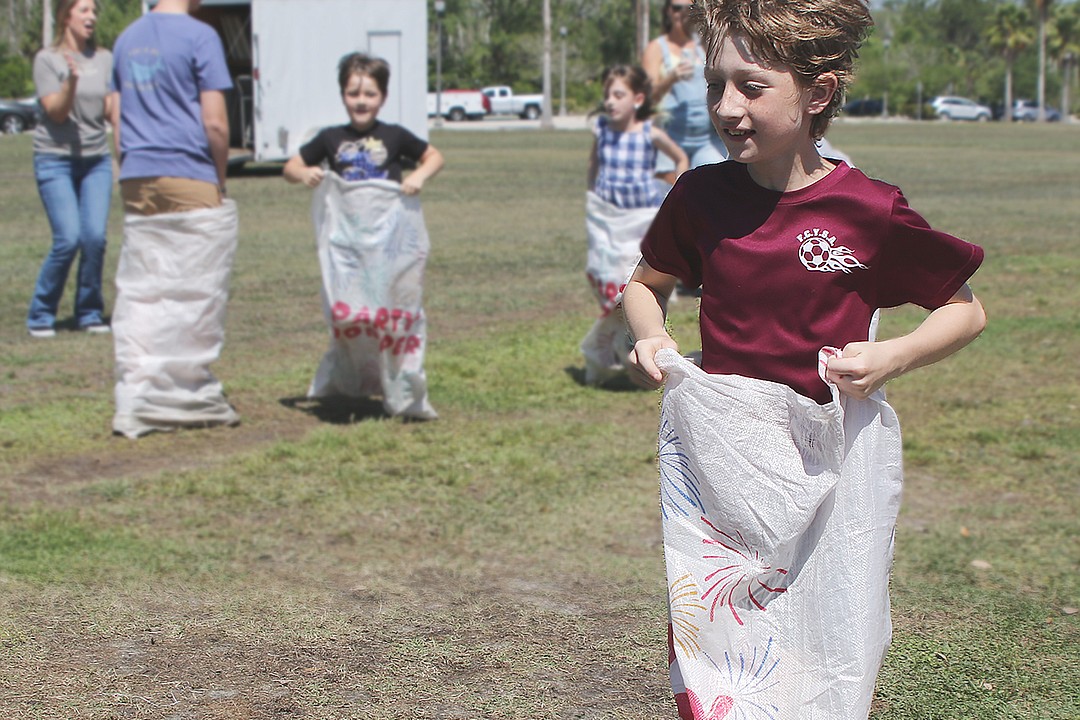 Children hunt for eggs, compete in ring toss and sack races at 2023 Egg