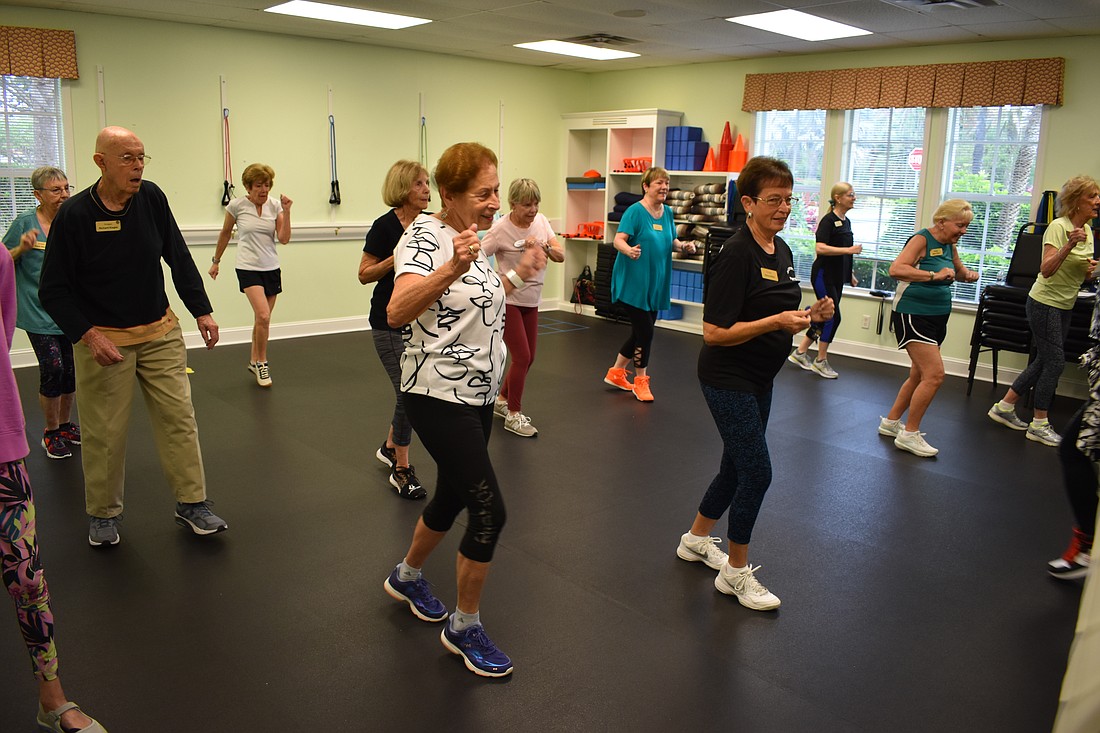 Class members practice at The Glenridge Fitness Center and Spa on March 29.