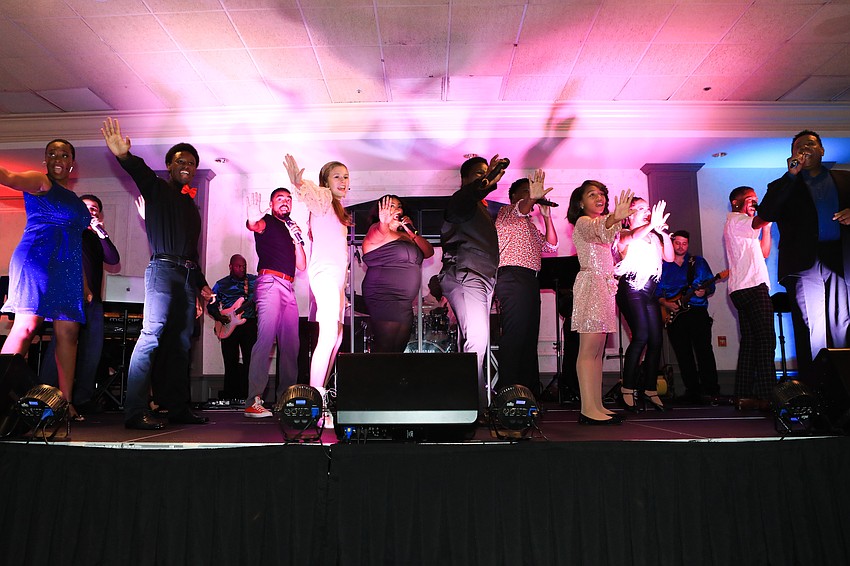 Nate Jacobs led the performers in song.