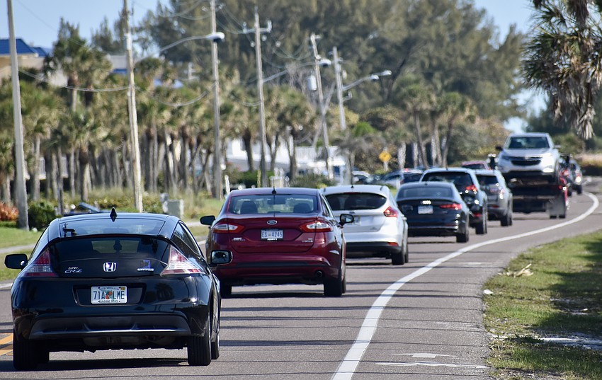 Traffic moves through Longboat Key on Gulf of Mexico Drive.