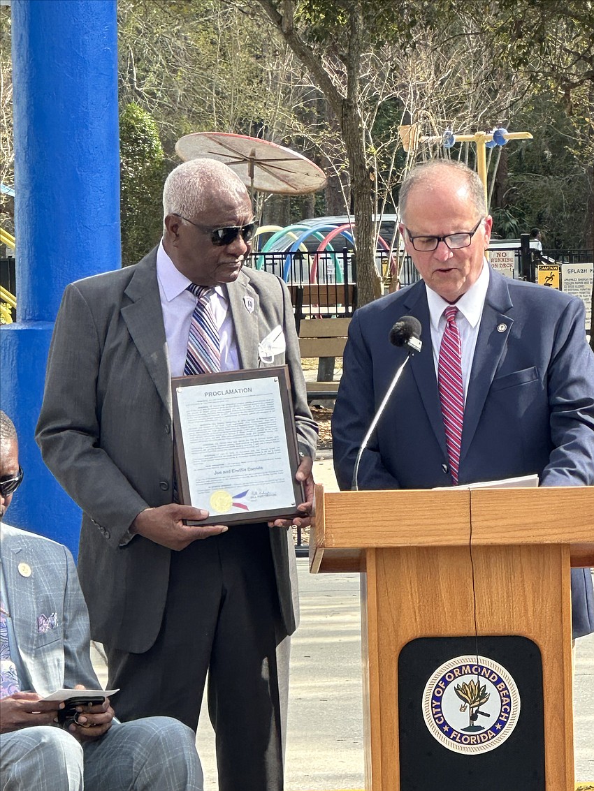 Joe Daniels is recognized by Mayor Bill Partington during a city naming ceremony on March 4. Photo courtesy of the city of Ormond Beach