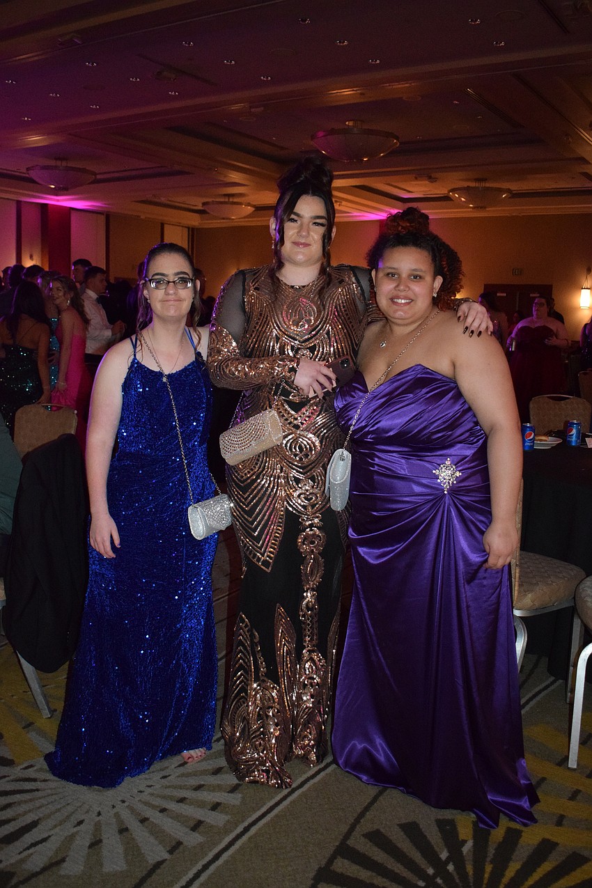 Junior Natasha Kidd, Kylie Lawson, who graduated in 2022, and junior Airanna Gibbons are excited to be at prom.