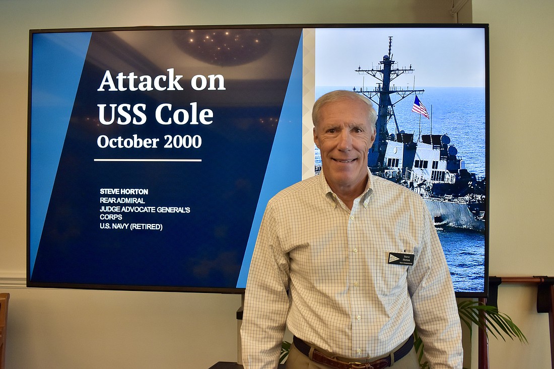 Steve Horton shares his experience drafting the USS Cole Commission report at the Bird Key Yacht Club on Wednesday.