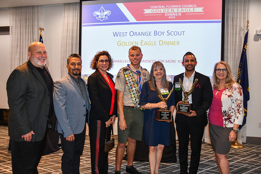 Joe Dunn, of Friends of Lake Apopka; Oakland Town Commissioner Sal Ramos; Iliana Ramos; Eagle Scout Caleb Farr; Oakland Mayor Kathy Stark; Orlando Health’s Philip Koovakada; and former Orange County Commissioner Betsy VanderLey.