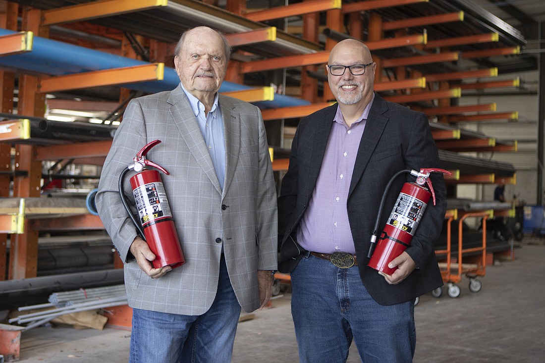 Piper Fire Protection founder Terry Johnson, left, and his eldest son Chris, who's now the company's president, CEO and majority owner.