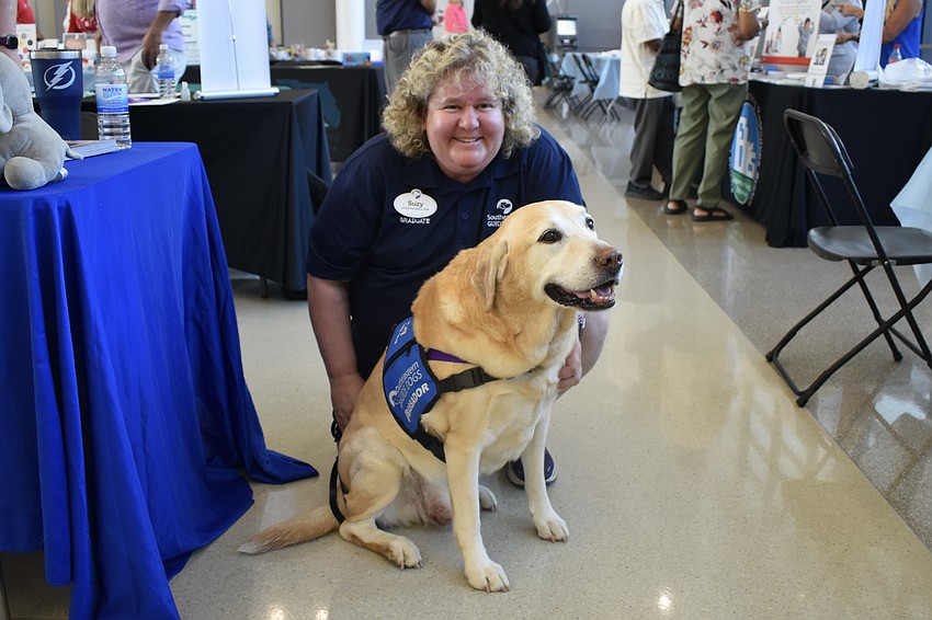 Suzy Wilburn of Southeastern Guide Dogs, and Carson