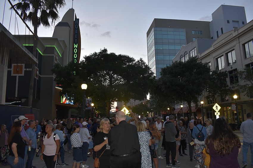 The crowd gathers in front of Regal Hollywood before the walk.